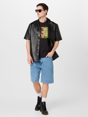 Carhartt WIP Loosefit Shorts 'Landon' in Blau