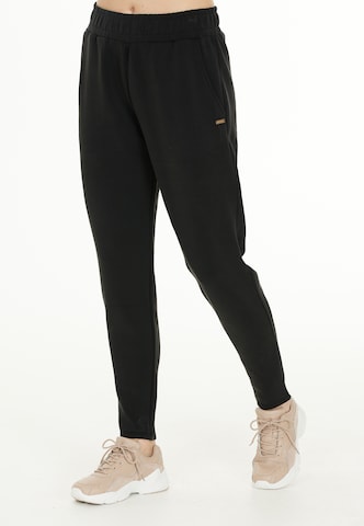 Athlecia - Tapered Pantalón deportivo en negro: frente