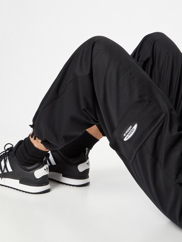 ADIDAS ORIGINALSLoosefit Cargo hlače - crna boja