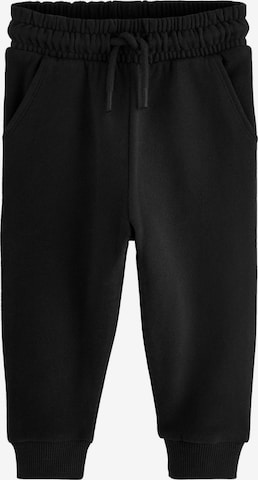 Next Tapered Trousers in Black: front