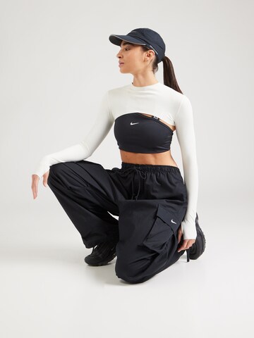 Largi Pantaloni cu buzunare de la Nike Sportswear pe negru