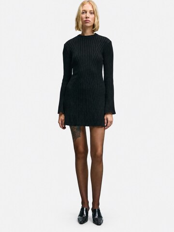 Robes en maille 'Strickkleider' Ethiquet en noir