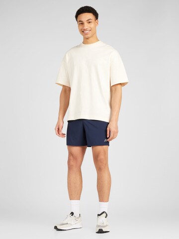 new balance Regular Sportshorts 'Core Run 5' in Blau