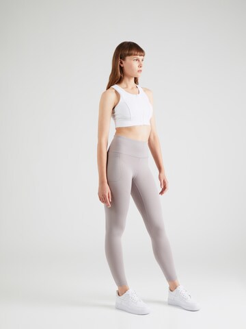 UNDER ARMOUR Skinny Sporthose 'Motion' in Lila