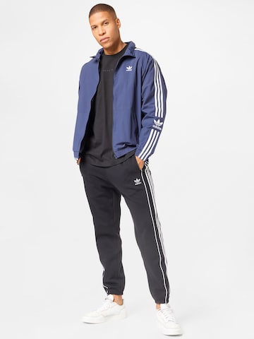 juoda ADIDAS ORIGINALS Siaurėjantis Kelnės 'Rekive'