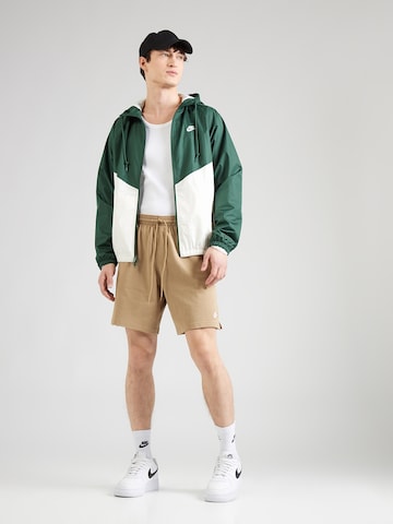 Loosefit Pantalon 'CLUB' Nike Sportswear en beige