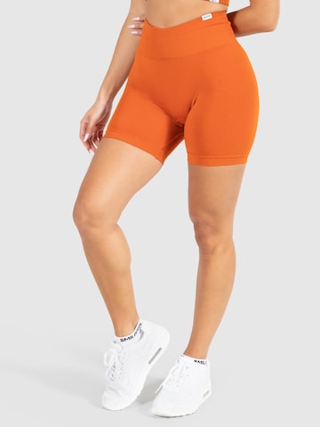 Smilodox Skinny Sportbroek 'Amaze Pro' in Oranje