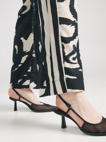 Wide leg Pantaloni di ONLY Carmakoma in nero