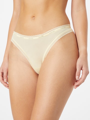 Tanga de la Calvin Klein Underwear pe bej: față