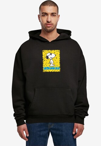 Merchcode Sweatshirt 'Peanuts - Player' in Zwart: voorkant