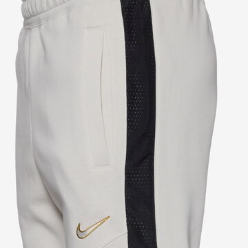 Nike Sportswear Tapered Hose in Beige