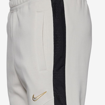 Nike Sportswear Tapered Pants in Beige