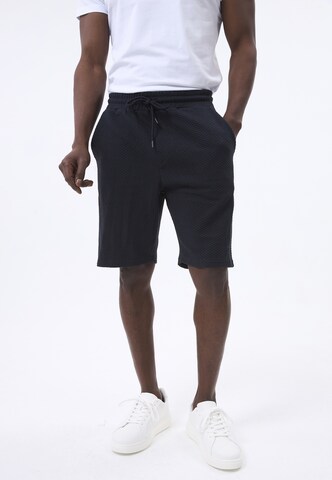 Felix Hardy Regular Trousers in Blue: front