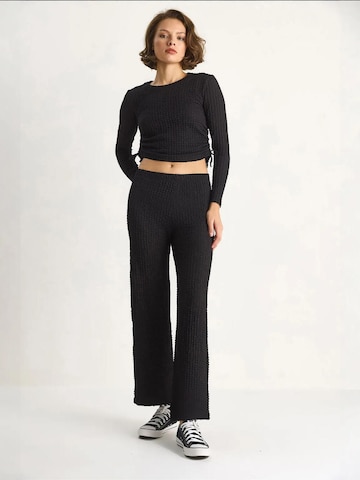 Pantalons de tailleur Bianco Lucci en noir