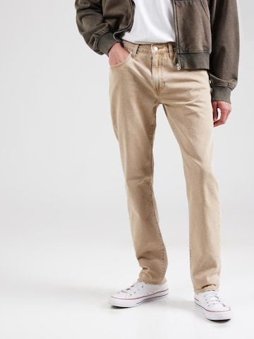 LEVI'S ® Tapered Jeans '502' in Beige: front