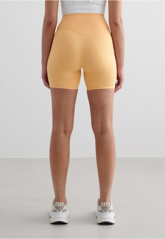 Aim'n Skinny Sportbroek 'Sense' in Oranje