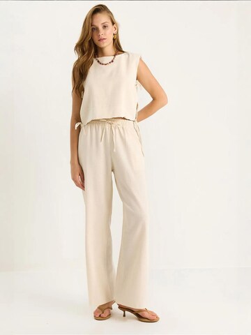 Bianco Lucci - Calças de fato em bege: frente