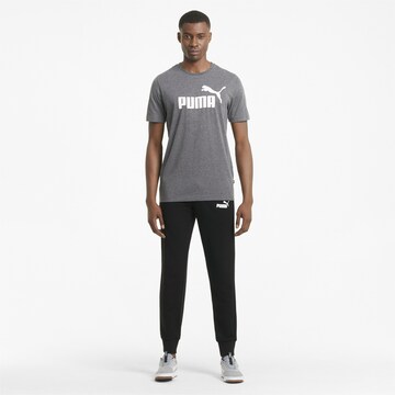 PUMA Tapered Sportbroek in Zwart