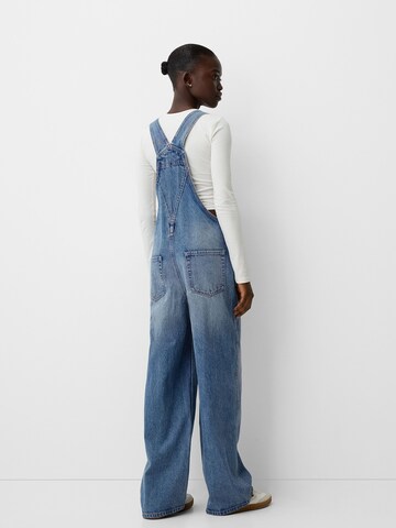 Bershka Loose fit Dungaree jeans in Blue