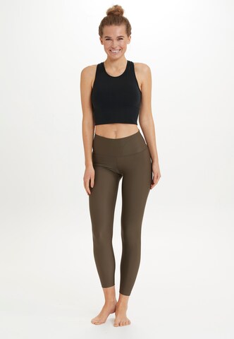Athlecia Skinny Sportbroek 'Cadidell' in Bruin