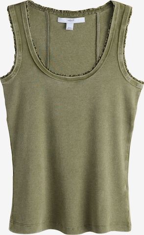 Haut Next en vert : devant