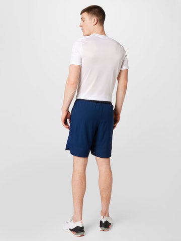 UNDER ARMOUR Normální Sportovní kalhoty 'Vanish' – modrá