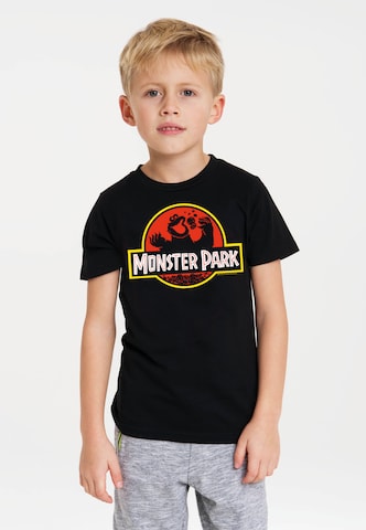 LOGOSHIRT T-Shirt 'Sesamstrasse Krümelmonster Monster Park' in Schwarz: predná strana