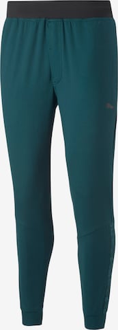 PUMATapered Sportske hlače - zelena boja: prednji dio