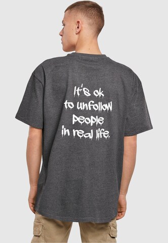 Merchcode T-Shirt 'Unfollow' in Grau