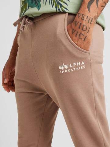 Tapered Pantaloni di ALPHA INDUSTRIES in marrone