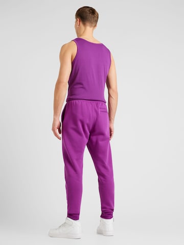 Nike Sportswear Zwężany krój Spodnie 'CLUB FLEECE' w kolorze fioletowy