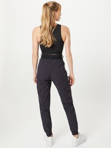 Effilé Pantalon de sport aim'n en noir