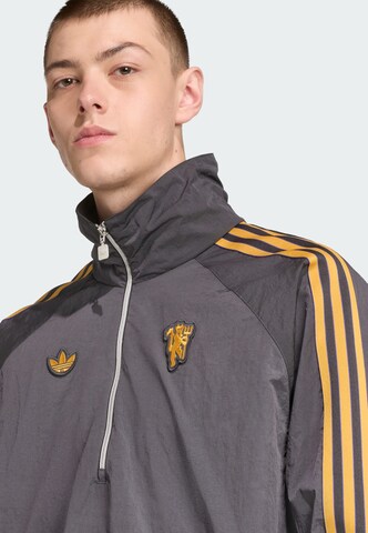 Veste mi-saison 'Manchester United Terrace Icons' ADIDAS ORIGINALS en noir
