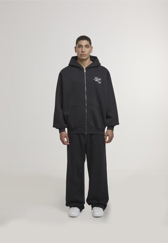 Karl Kani - Sudadera con cremallera 'Varsity' en negro