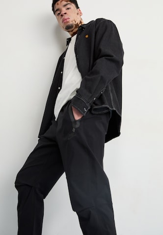 Nike Sportswear Tapered Byxa i svart