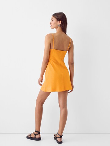 Bershka Letné šaty - Oranžová