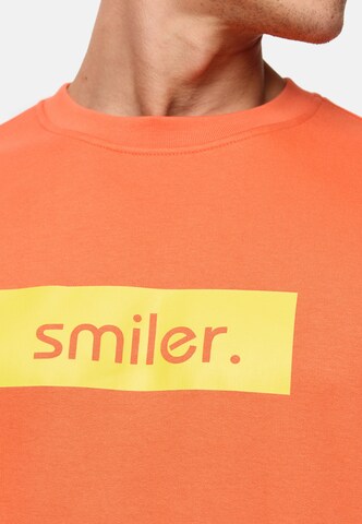 smiler. Sweatshirt in Orange