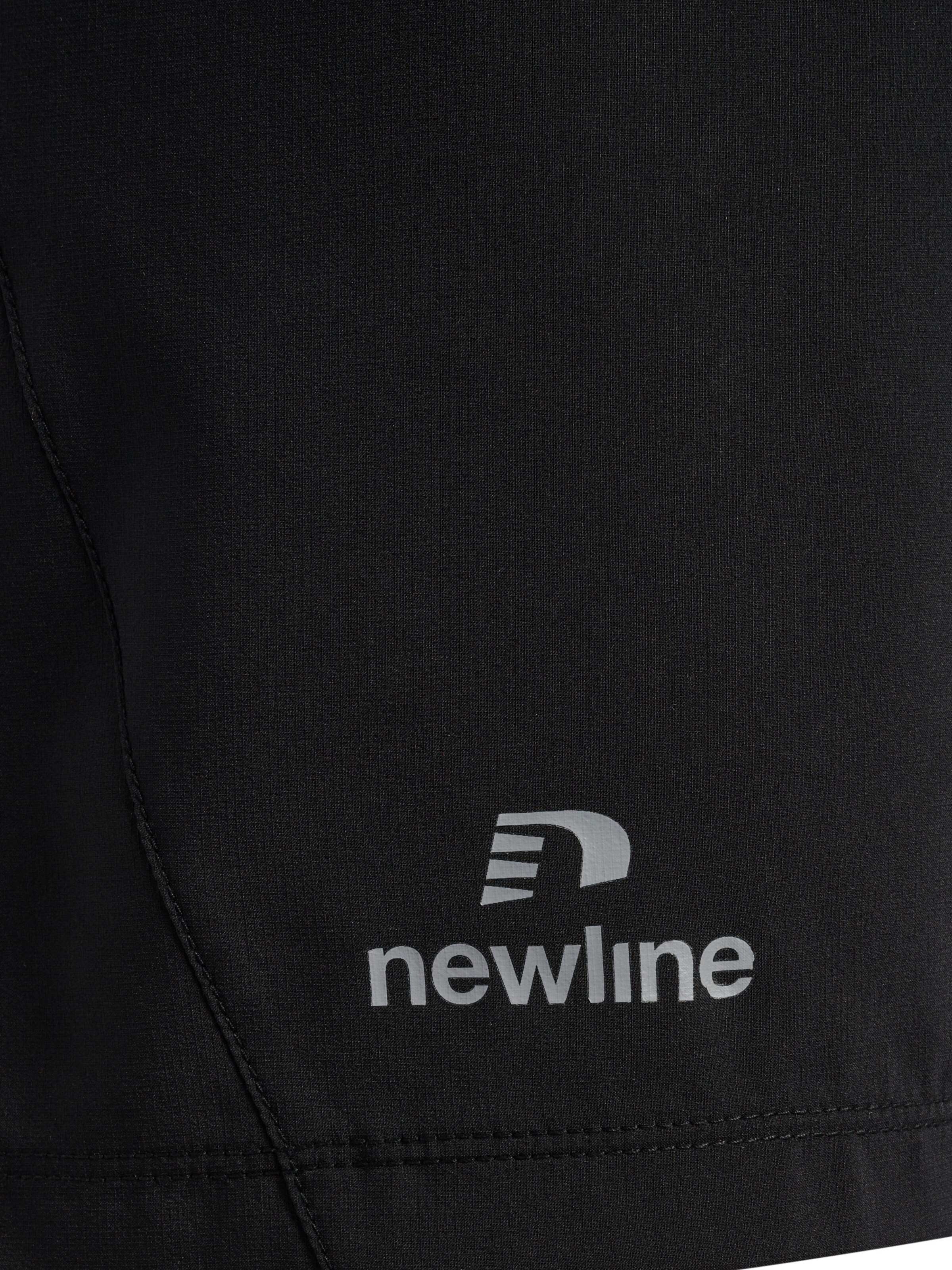 Newline Regular Trousers 'PERFORM' in Black