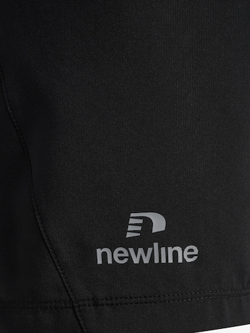 Newline Regular Pants 'PERFORM' in Black