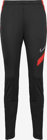 NIKE Tapered Workout Pants in Black: front