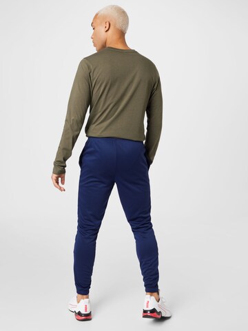 PUMATapered Sportske hlače 'TeamRise' - plava boja