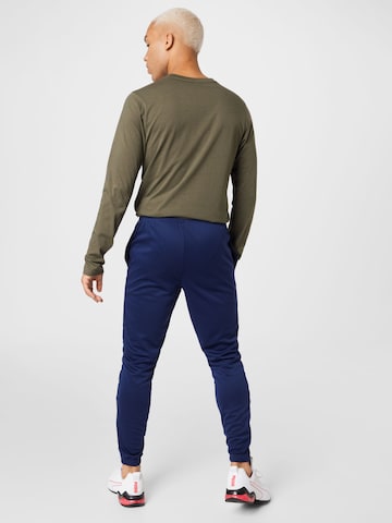 PUMA Tapered Sportbroek 'TeamRise' in Blauw