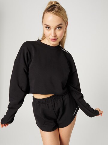 Hoermanseder x About You Sweatshirt 'Tessy' in Black: front