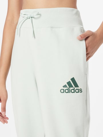 ADIDAS SPORTSWEAR Tapered Sports trousers 'Essentials Multi-Colored Logo' in Green