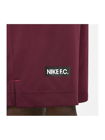 NIKE Regular Sports trousers in Red