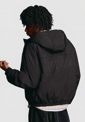 Bershka Between-season jacket in Black: front