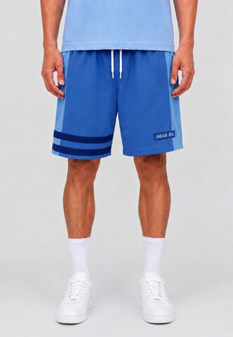 Unfair Athletics Regular Trousers 'DMWU' in Blue: front