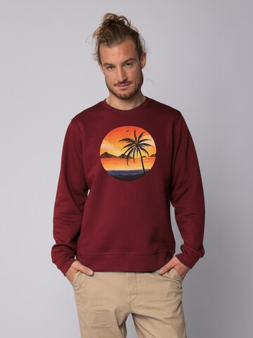 Felpa ' Sunset on palm beach ' di Watapparel in rosso: frontale