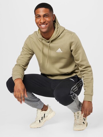 juoda ADIDAS SPORTSWEAR Siaurėjantis Sportinės kelnės 'Essentials Mélange French Terry'