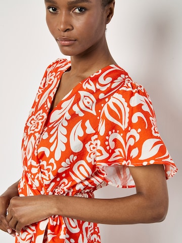 Robe ' ' Apricot en orange